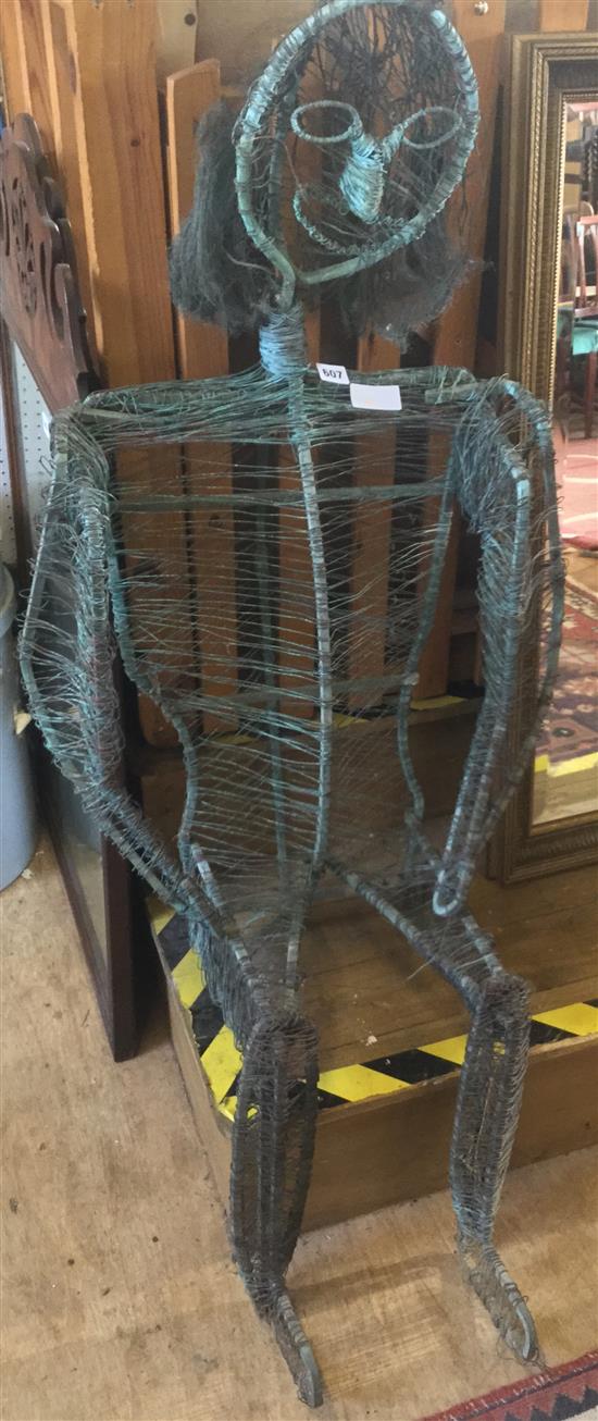Seated metal figure